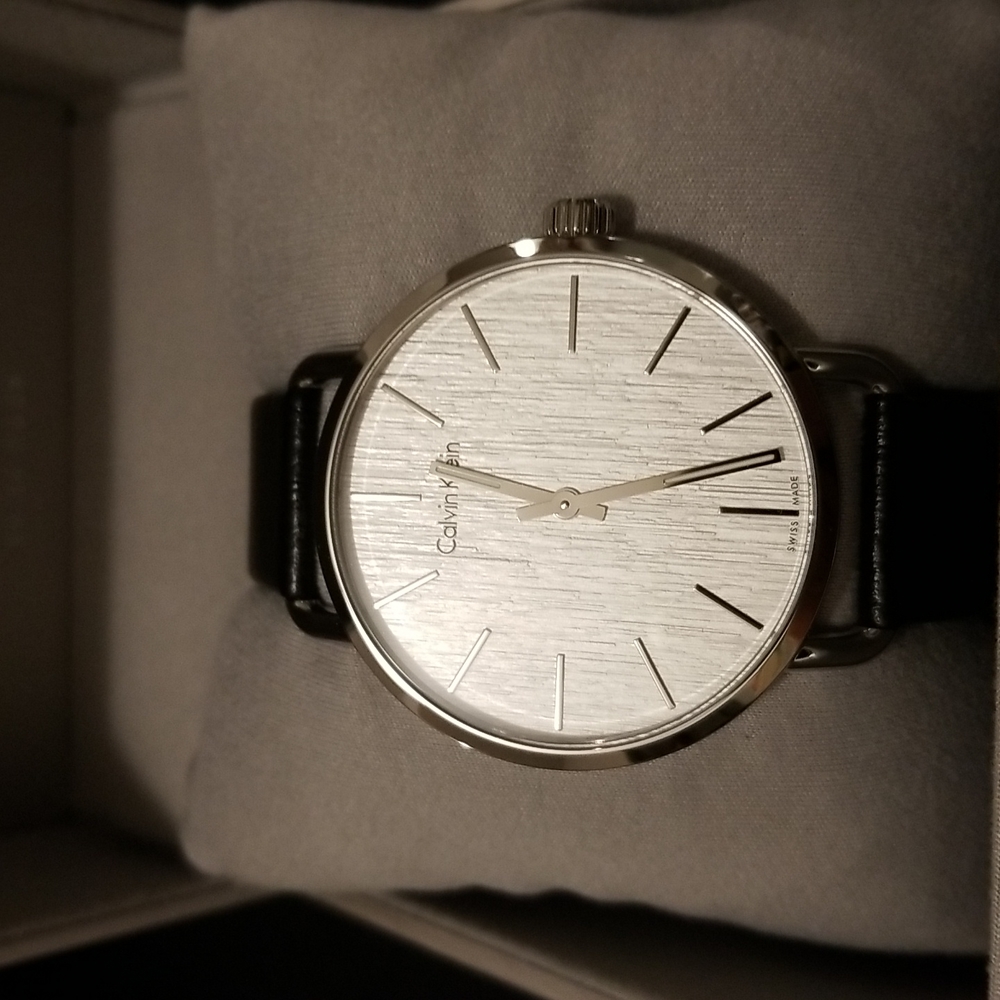 Calvin Klein men watch.  Black adjustable band.  New with original box.